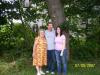Edna with grand daughter laura and her husband kevin under the old oak tree. 